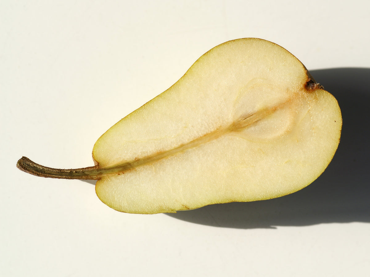 A Bartlett (Williams) pear cut in half lengthwise