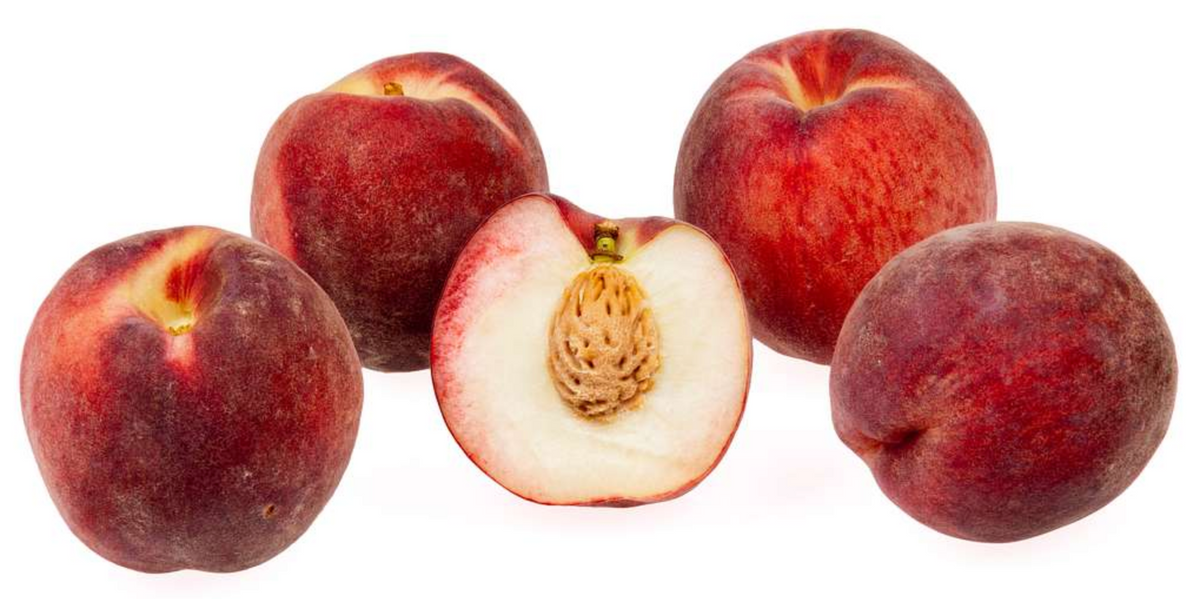 Blushingstar peach seedling fruit, whole and cut to show the white flesh