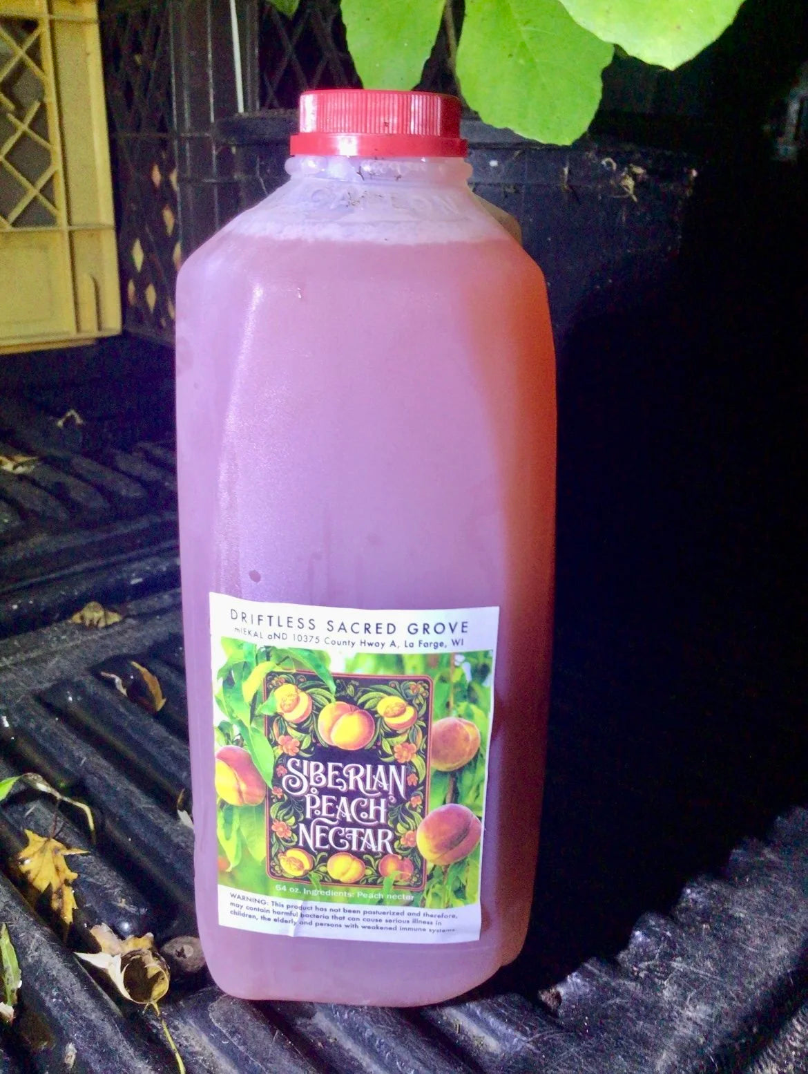 A jug of juice pressed from Siberian C peaches